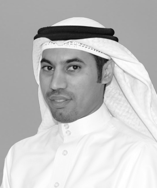 A black and white photo of a man in a white shirt, representing House Me Bahrain.