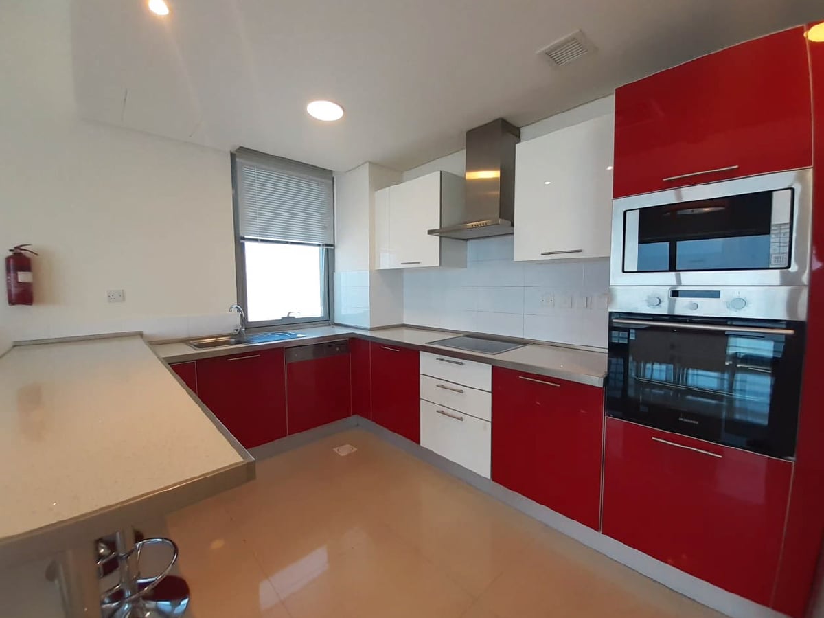 Fully furnished kitchen with stainless steel appliances.