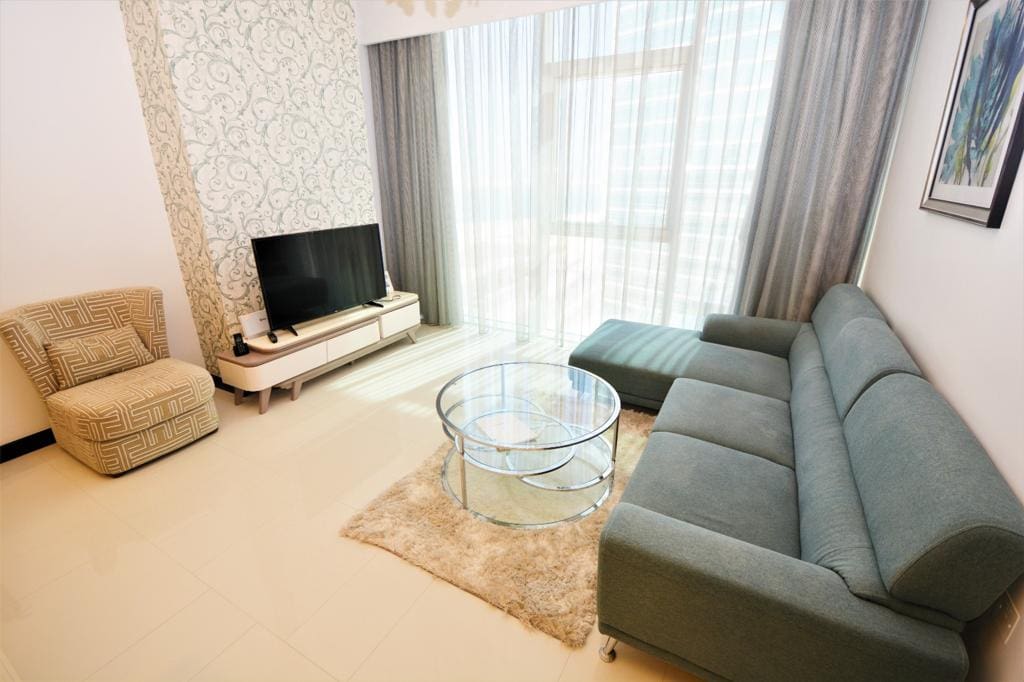 Stunning living room with a couch and tv.