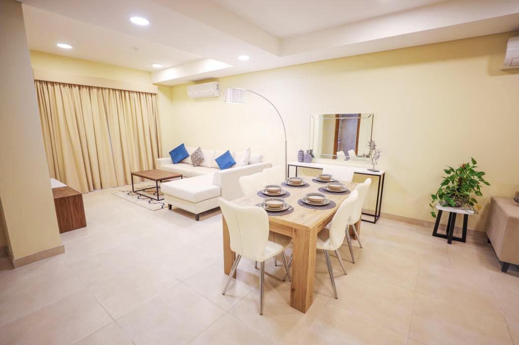 Amazing 2BR Apartments for Sale in Daih featuring a living room with a dining table and chairs.