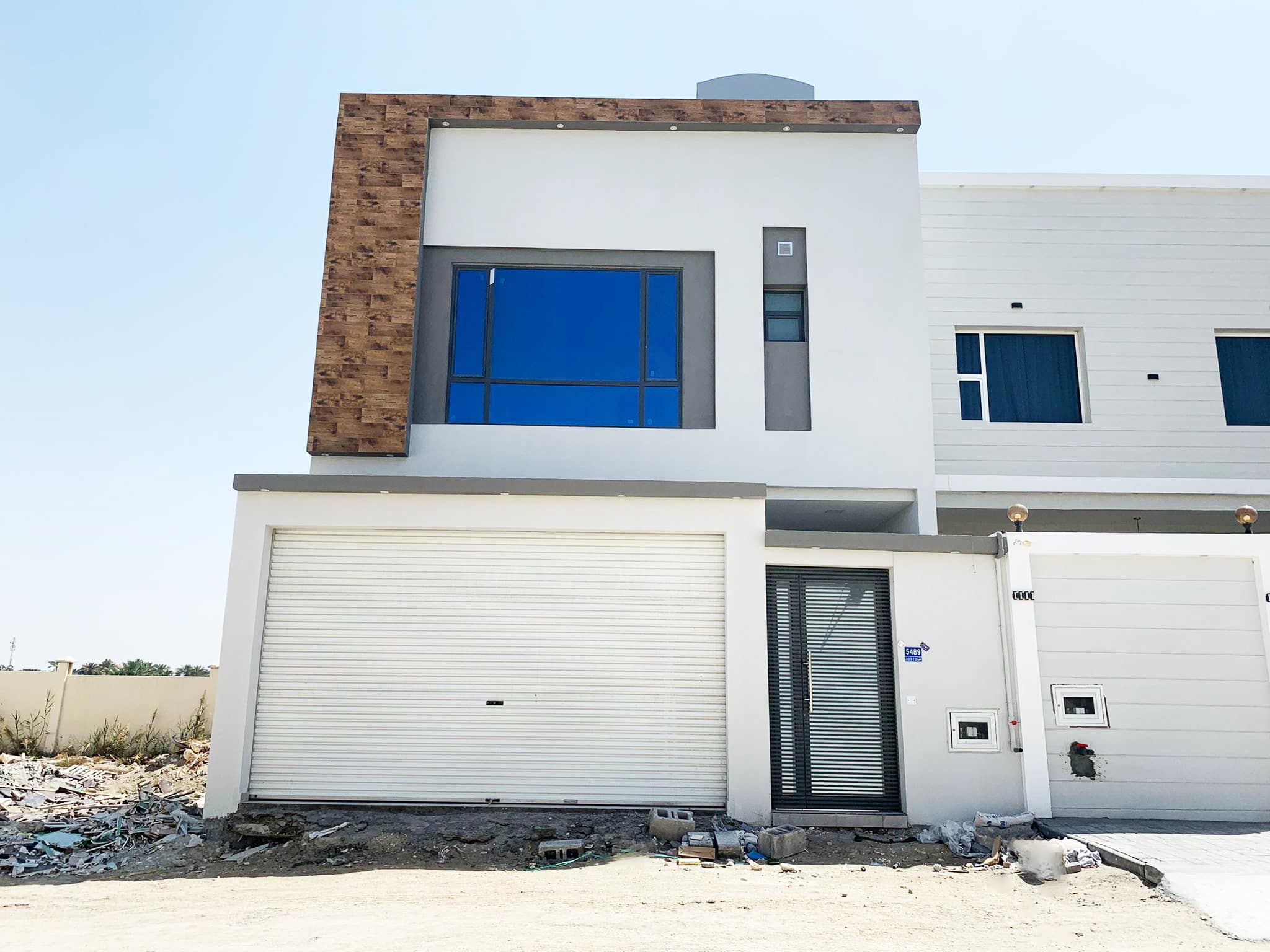 Perfect Location 4BR Villa for Sale in Malkiyah with a garage door.