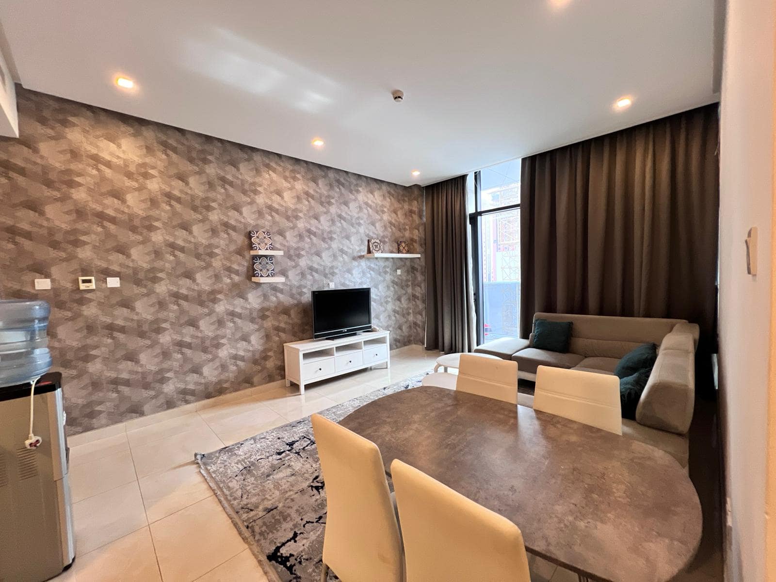 A living room and dining area in a modern apartment that is designed with an auto-draft system for optimal comfort.