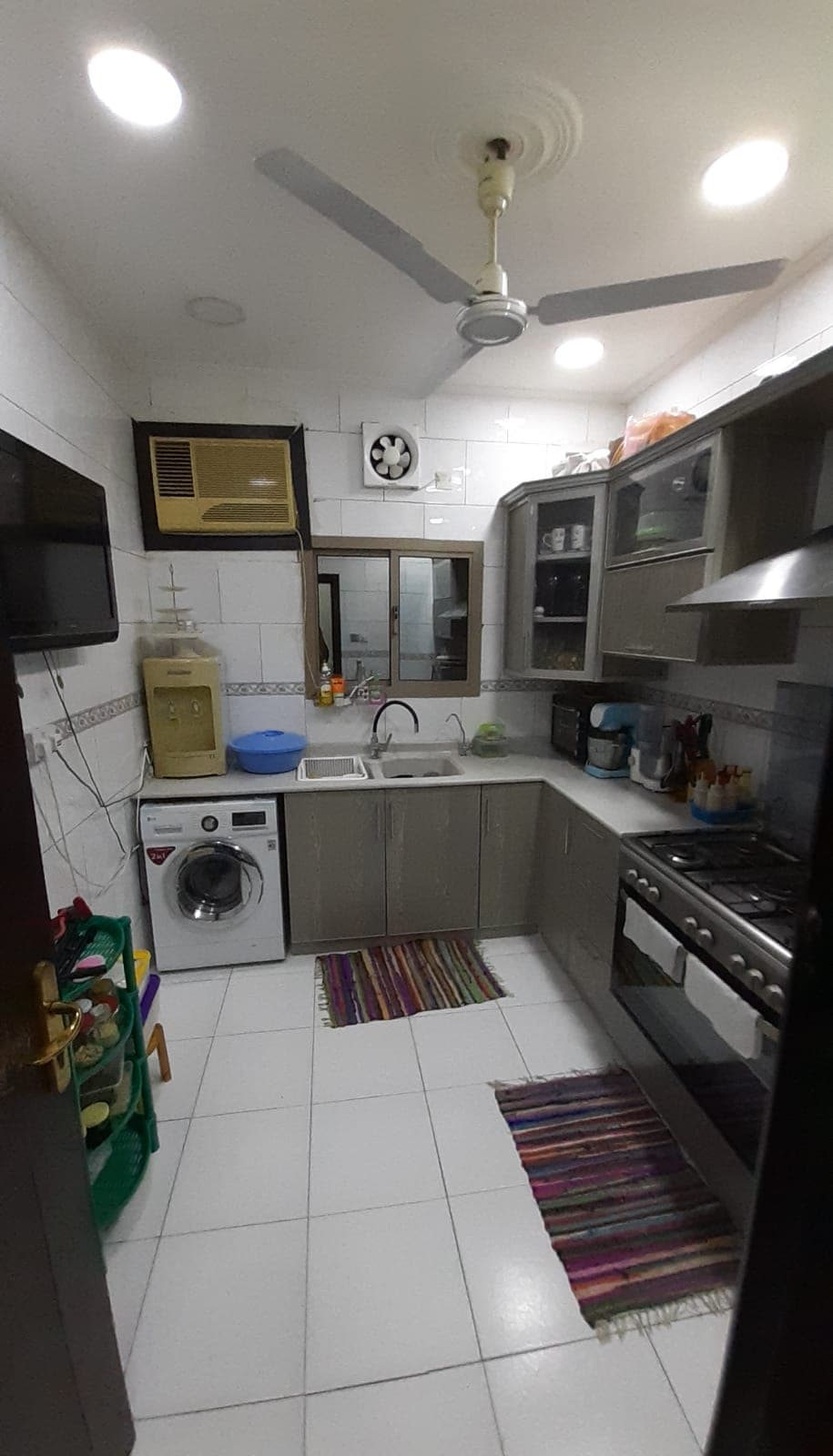 A Samaheej apartment with a sink and appliances for sale.