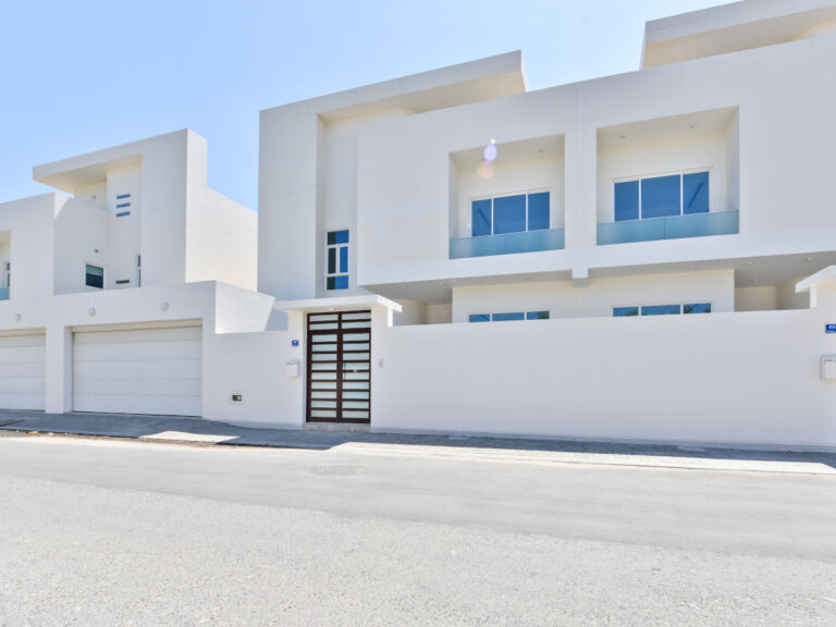 Luxury private 4BR villa in Saar with clear blue skies.