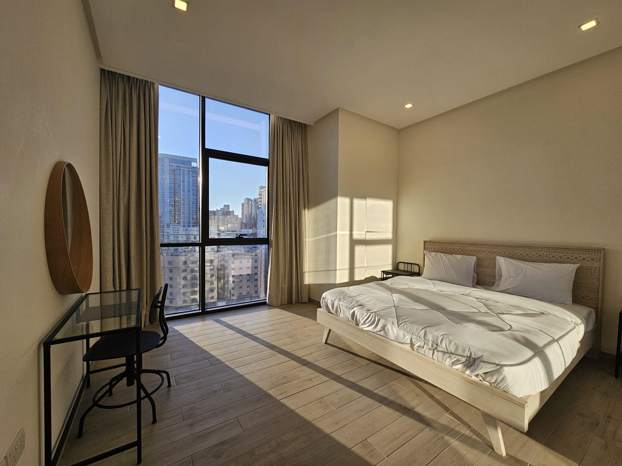 A city view bedroom with a large bed perfect for SEO.