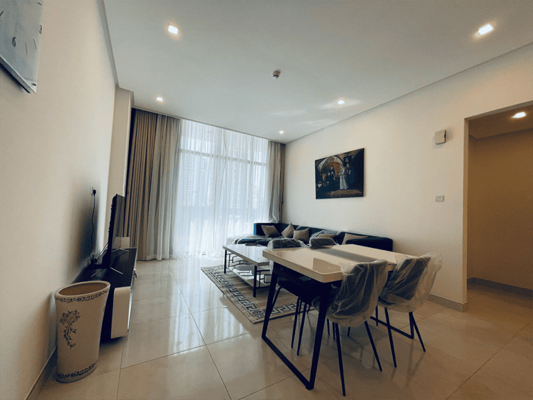 An amazing apartment for rent with a living room that includes a dining table and chairs in Juffair.