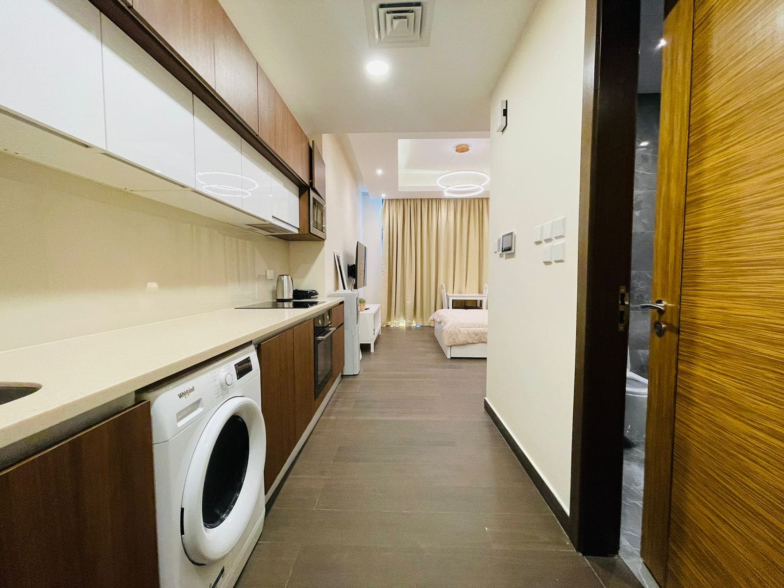 A modern living luxury studio in Juffair with a washer and dryer.