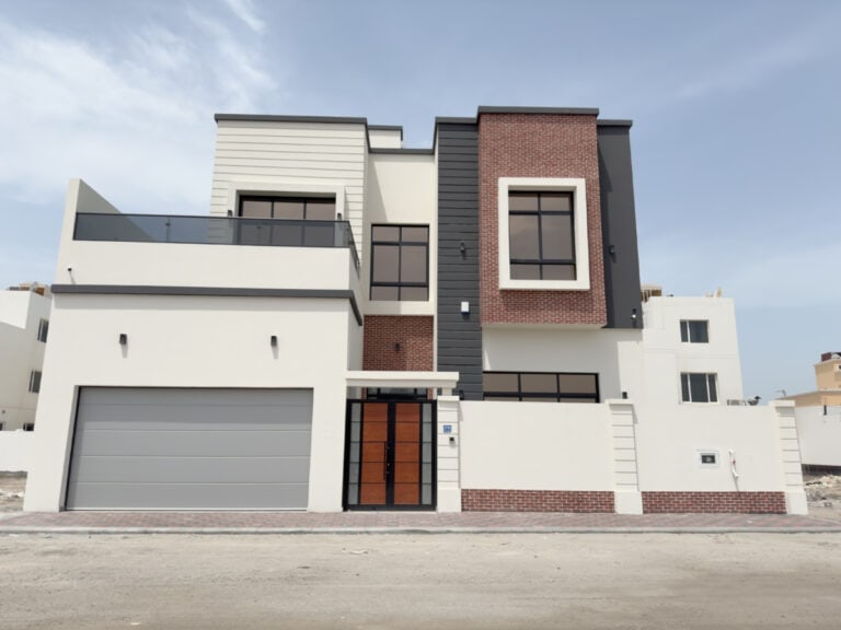 Magnificent Villa for Sale: Modern two-story home with mixed exterior finishes, featuring a front garage and a flat roof design.