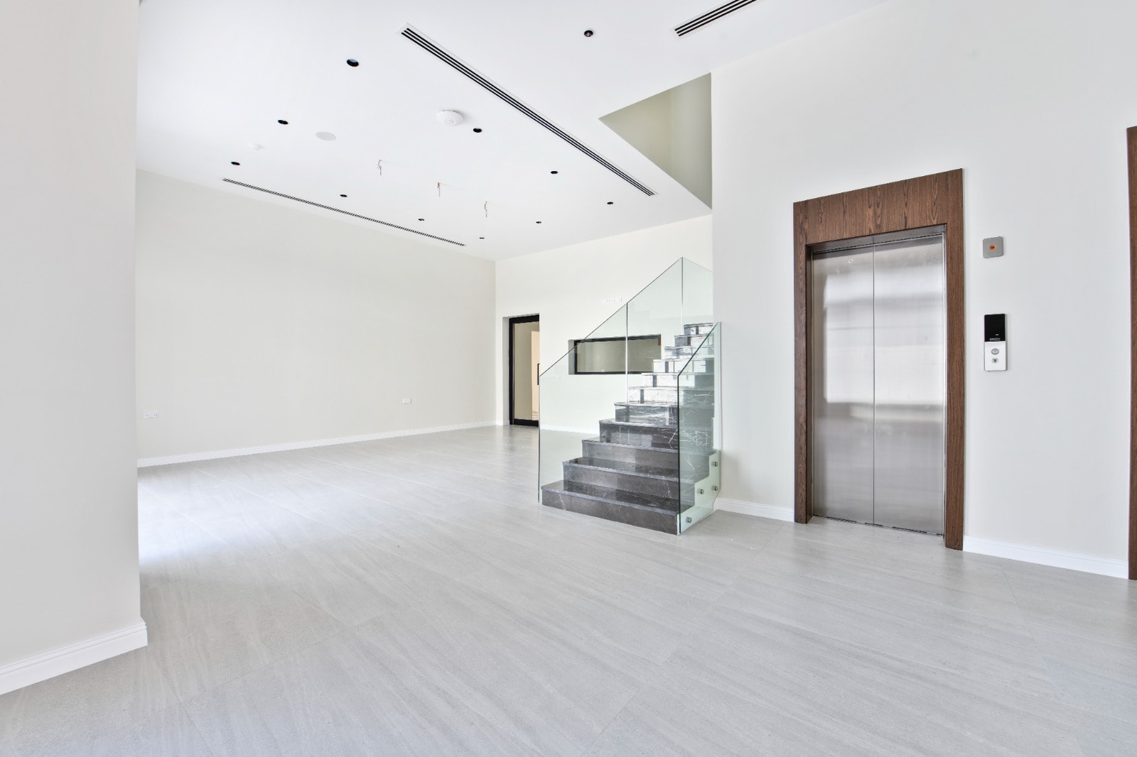 Minimalist modern lobby with staircase, elevator, and Auto Draft.