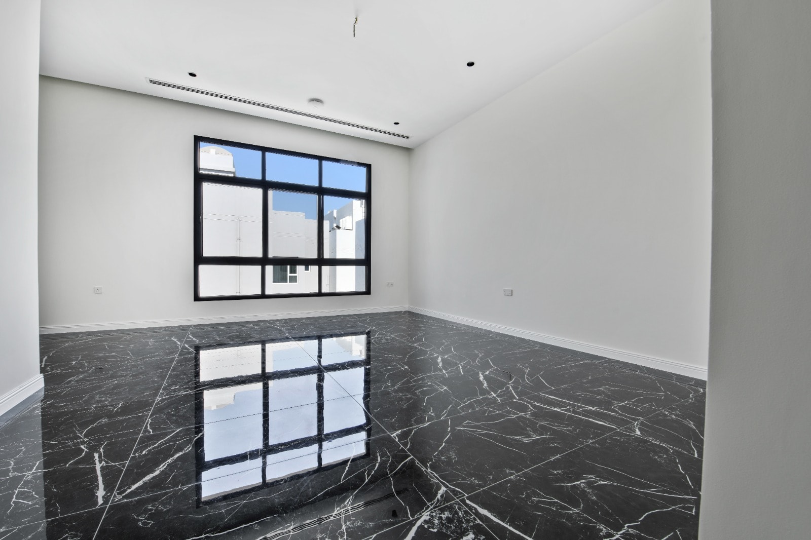 Modern empty room with marble flooring and a large window, designed for Auto Draft.