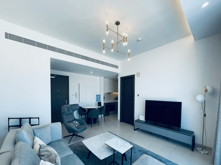 Modern living room with sleek furniture and minimalist decor.