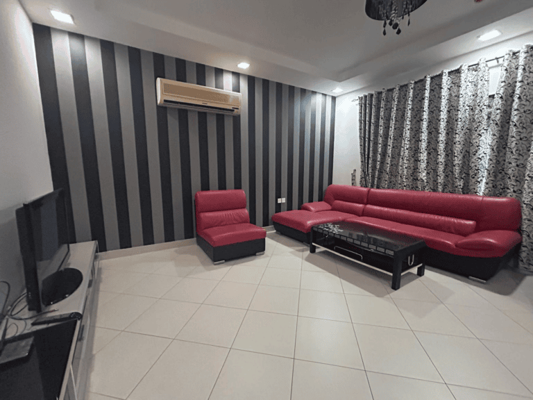 A luxury apartment living room with striped black and white wallpaper, a red sofa set, a glass coffee table, and a wall-mounted TV.