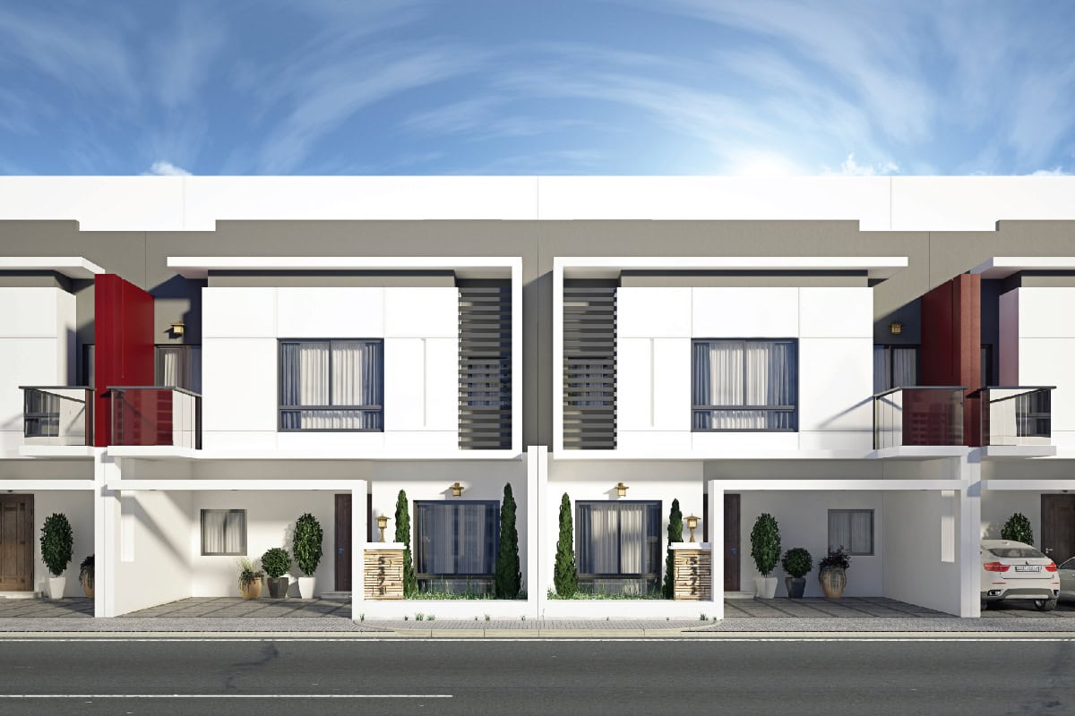 Modern two-story duplex with white exterior, large windows, balconies, and carports, set against a partly cloudy sky.