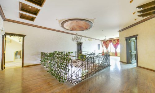 Spacious living room with hardwood floors.