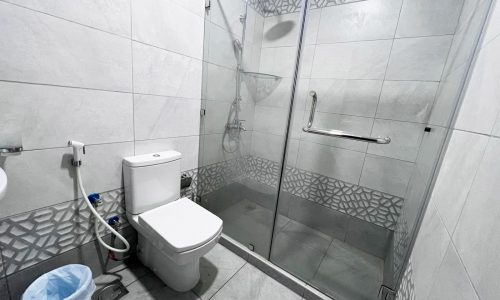 A bathroom with an impressive sink and shower stall.