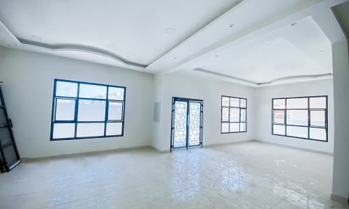 An eye-catching room with white tile floors and windows.