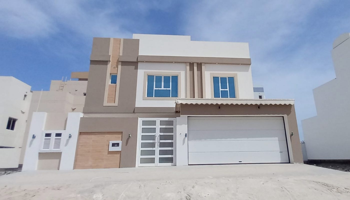 Ideal Location 4BR Villa for Sale in Bani Jamra with a garage in front.