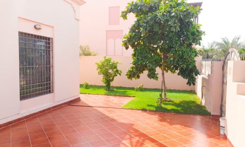 An amazing courtyard with a pink tiled floor.