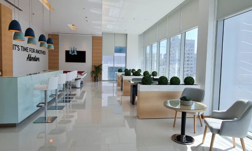 Fully furnished modern lobby in a luxury office building.