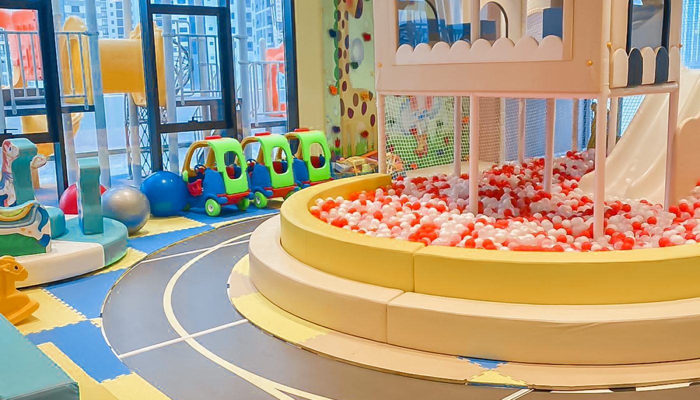 A children's play area with a basketball court in Juffair.