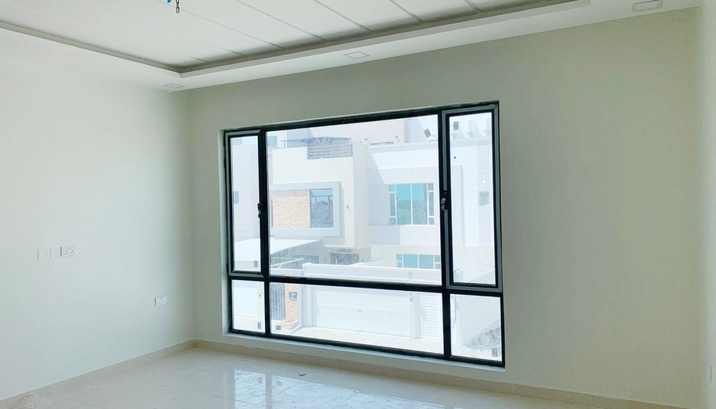 Ideal 4BR Villa for Sale in Al Malikiyah with large window and white floor.