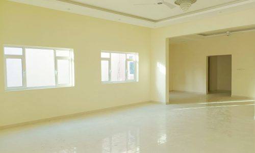 A fancy room with a white floor and a window.