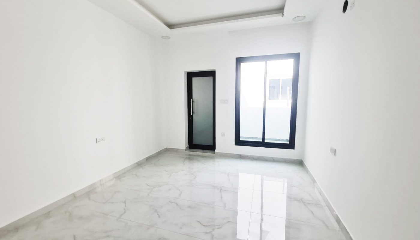 A modern luxury villa for sale in Barbar, featuring a 4-bedroom layout with white walls and marble floors.