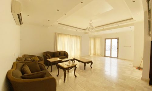 A luxurious living room with couches and a coffee table.