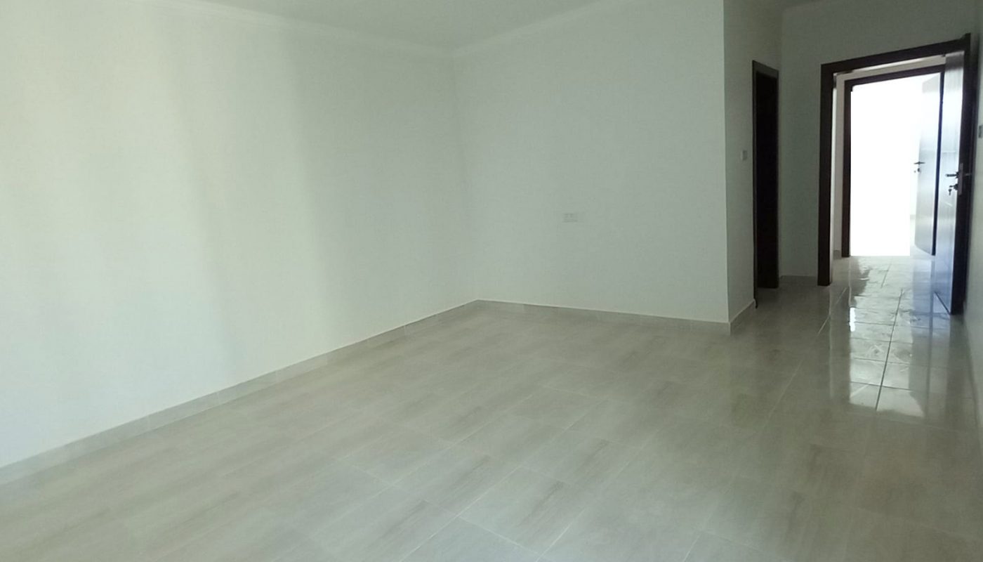 Ideal Location 4BR Villa for Sale in Bani Jamra featuring white walls and tile floors.