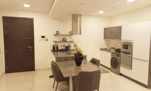 Luxury kitchen with a table and chairs.