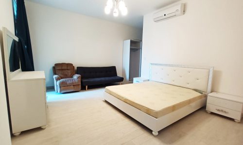 Luxury 3BR Apartment with White Bedroom and Couch in Seef.