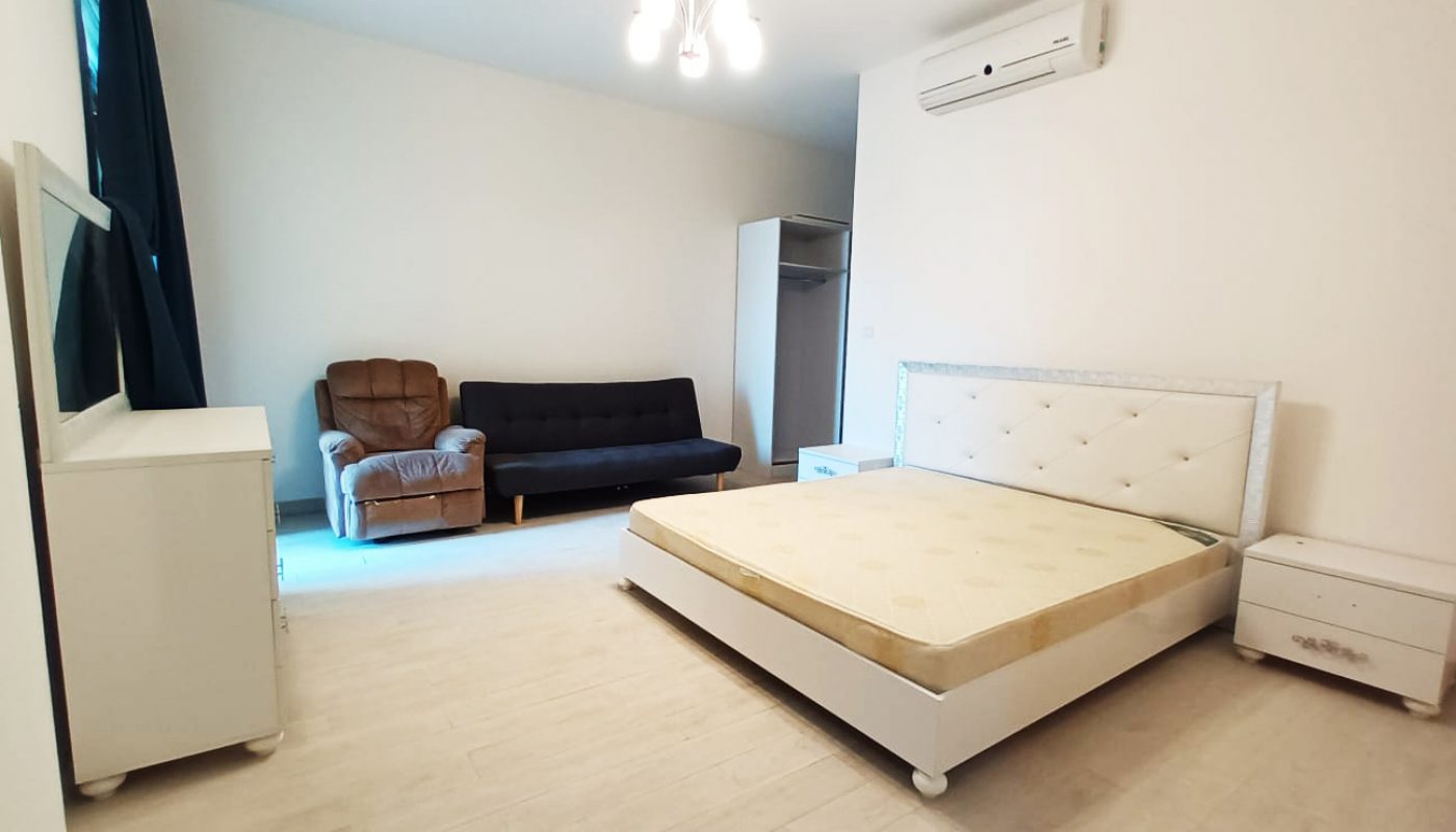 Luxury 3BR Apartment with White Bedroom and Couch in Seef.