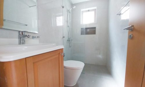 Rent a small 2BR apartment with an amazing bathroom featuring a toilet and sink.