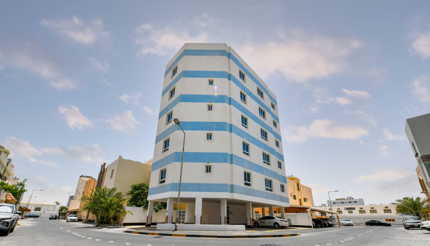 An office for rent in the middle of Sanabis street, featuring a blue and white building.