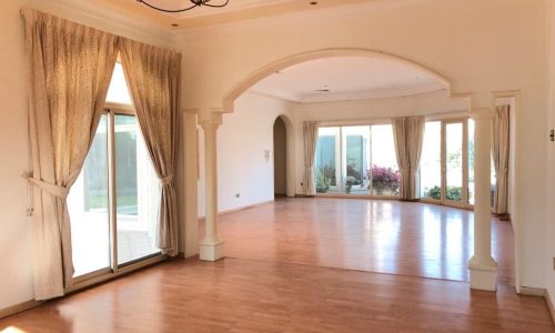 Luxury | An empty living room with wooden floors in a 3BR SF Villa for Rent in Saar.