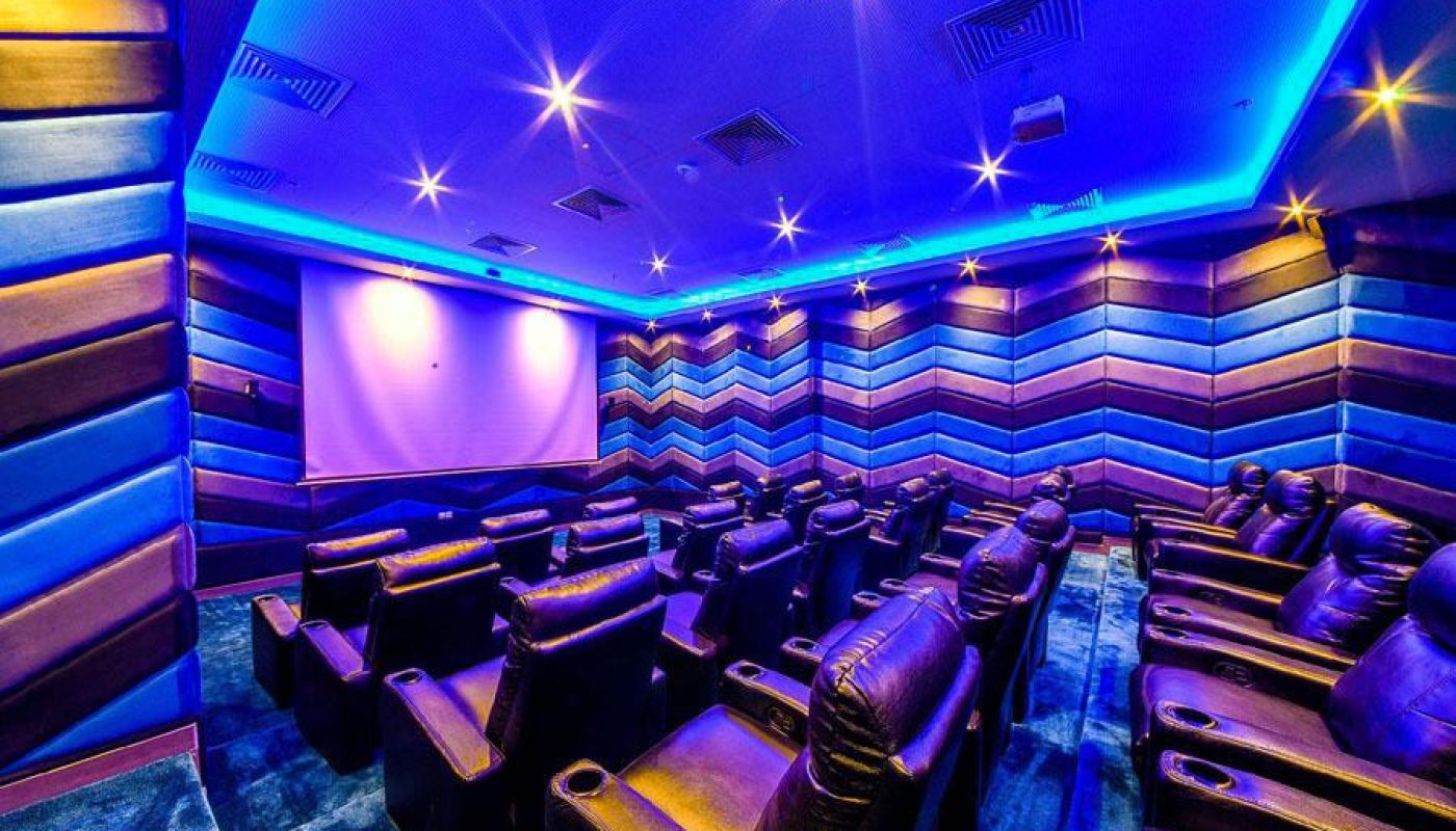 A movie theater with comfortable leather seats.