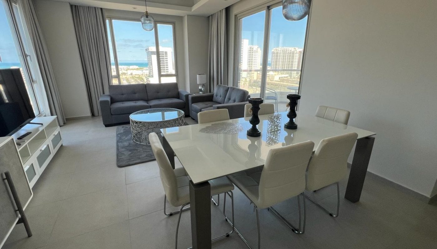 Rent a flat in Amwaj with a living room and dining area, offering a breathtaking view of the ocean.