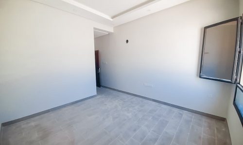 A stunning villa with a white floor and a window.