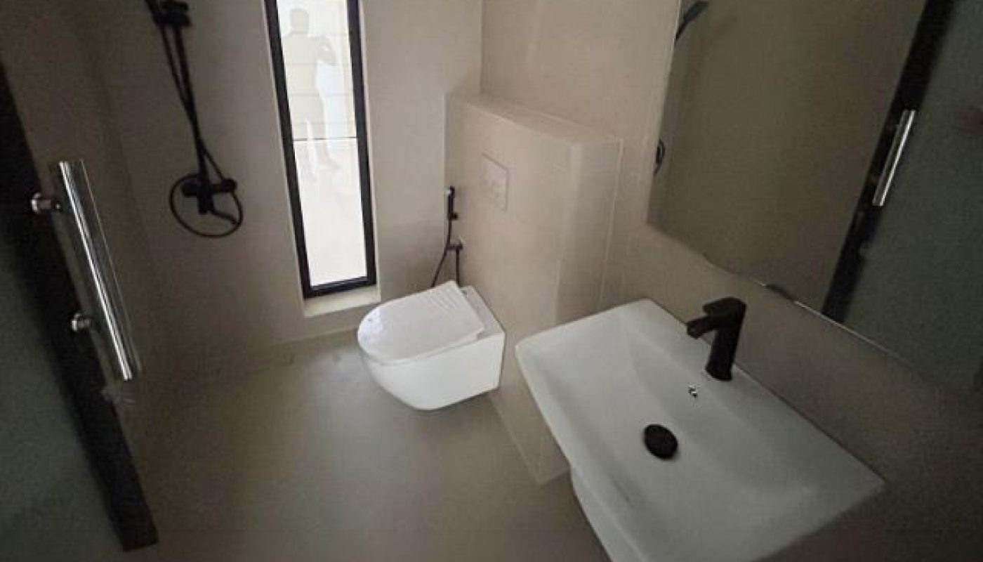 Minimalist bathroom with a wall-mounted toilet, rectangular sink, black fixtures, shower area, tall narrow window, and large mirror.