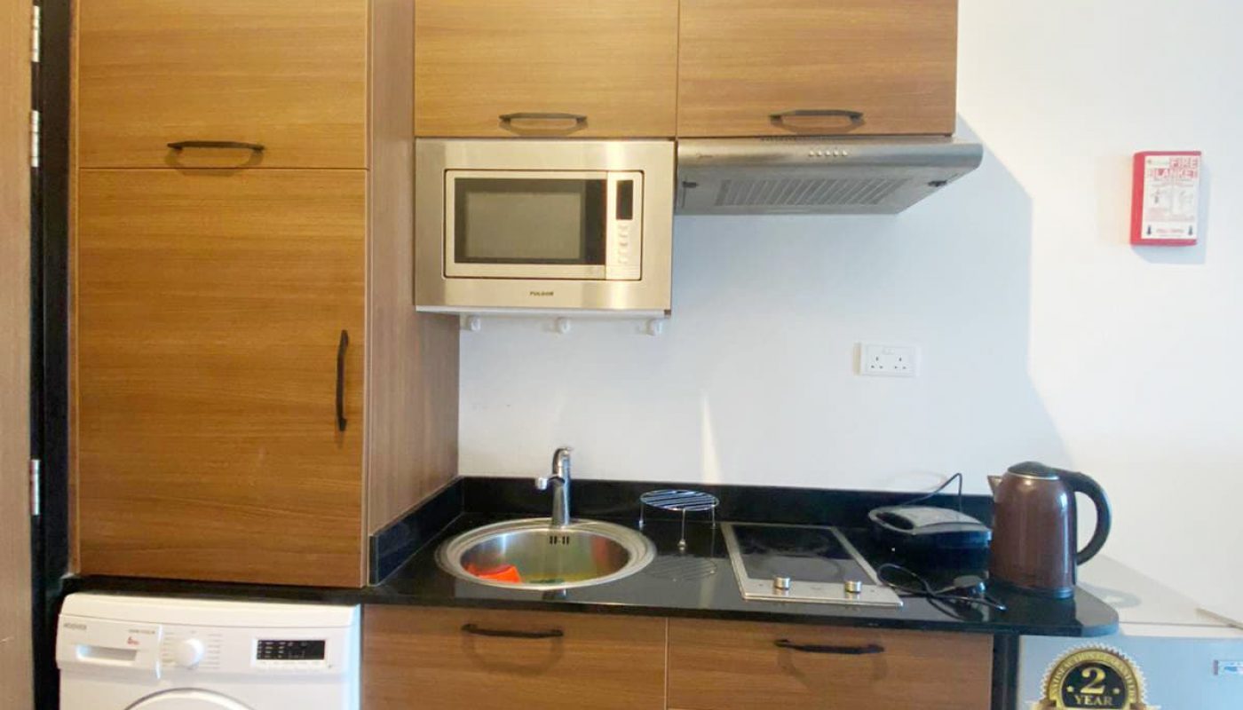 Luxury Studio for Rent in Busaiteen with small kitchen and washer.