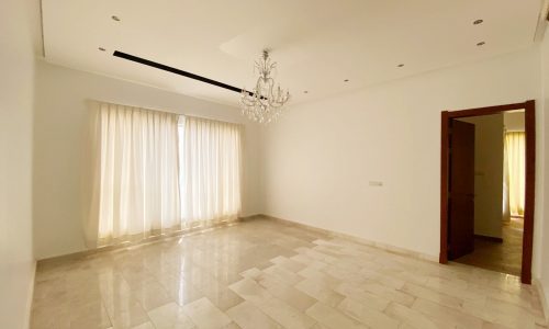 Amazing 6BR Villa with white tile floors and a chandelier for Sale in Al Markh.