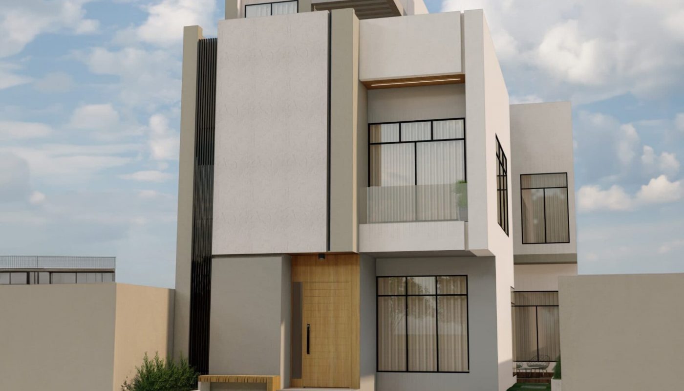 Modern three-story house with flat roofs, large windows, and a minimalistic design against a partly cloudy sky. Beige walls with dark accents, surrounded by a low wall and paved driveway.