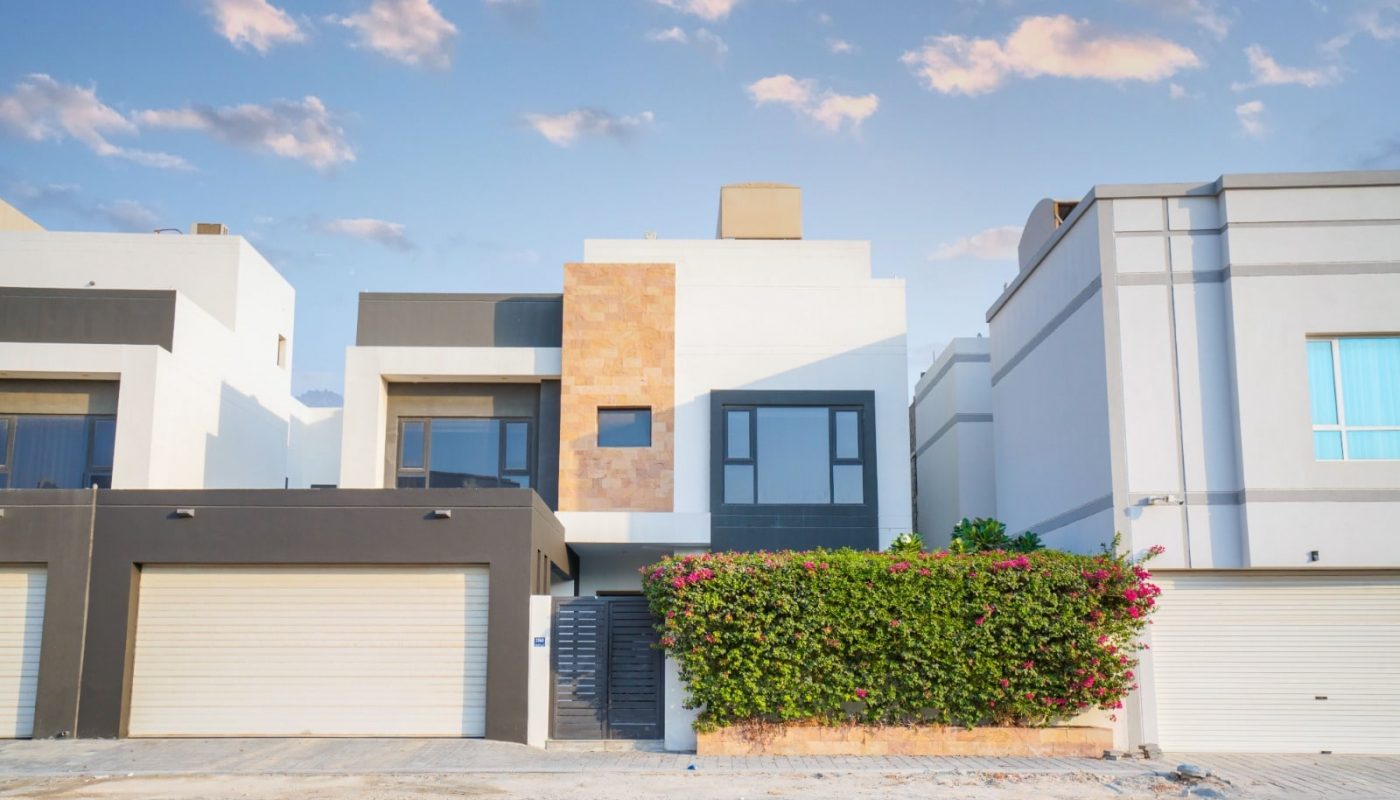 A modern villa with two garages.