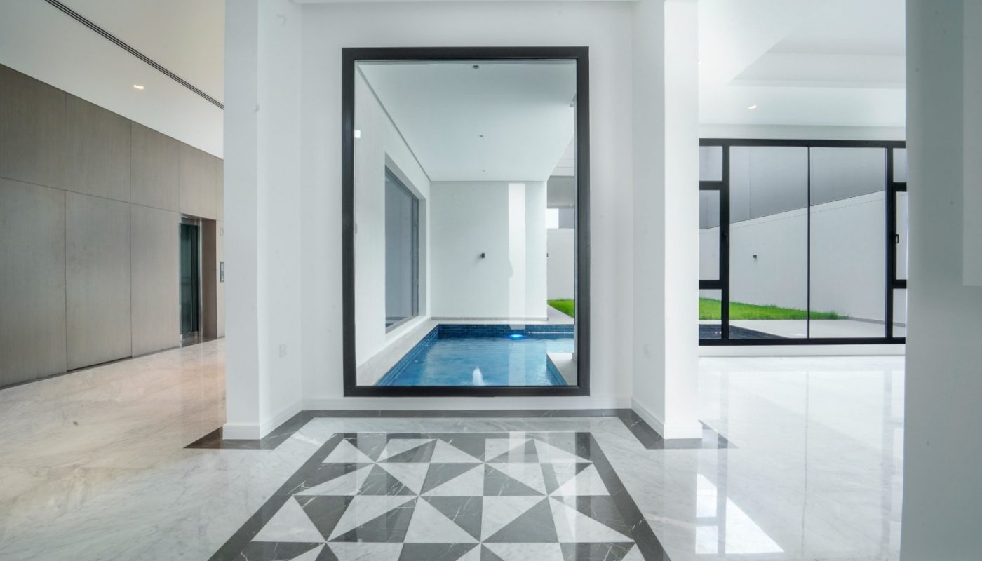 An exceptional modern house with a pool and a marble floor.