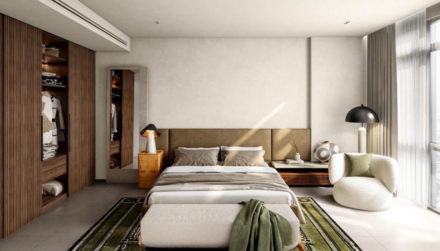 Modern bedroom with a double bed, green patterned rug, open closet, large windows with sheer curtains, and contemporary furniture including a round chair and black lamp.
