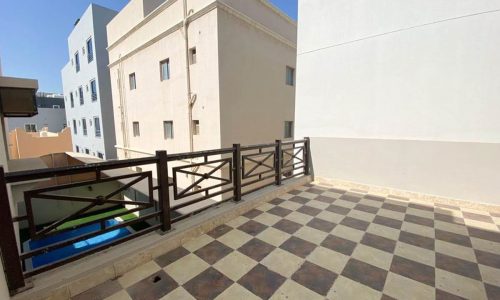 A breathtaking 3Beds Villa for Sale in Saar with a checkered tile floor balcony.