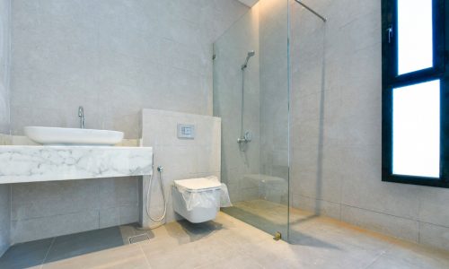 A modern bathroom with a glass shower.