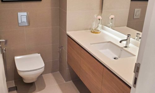 A Marassi apartment with a toilet and sink available for rent.