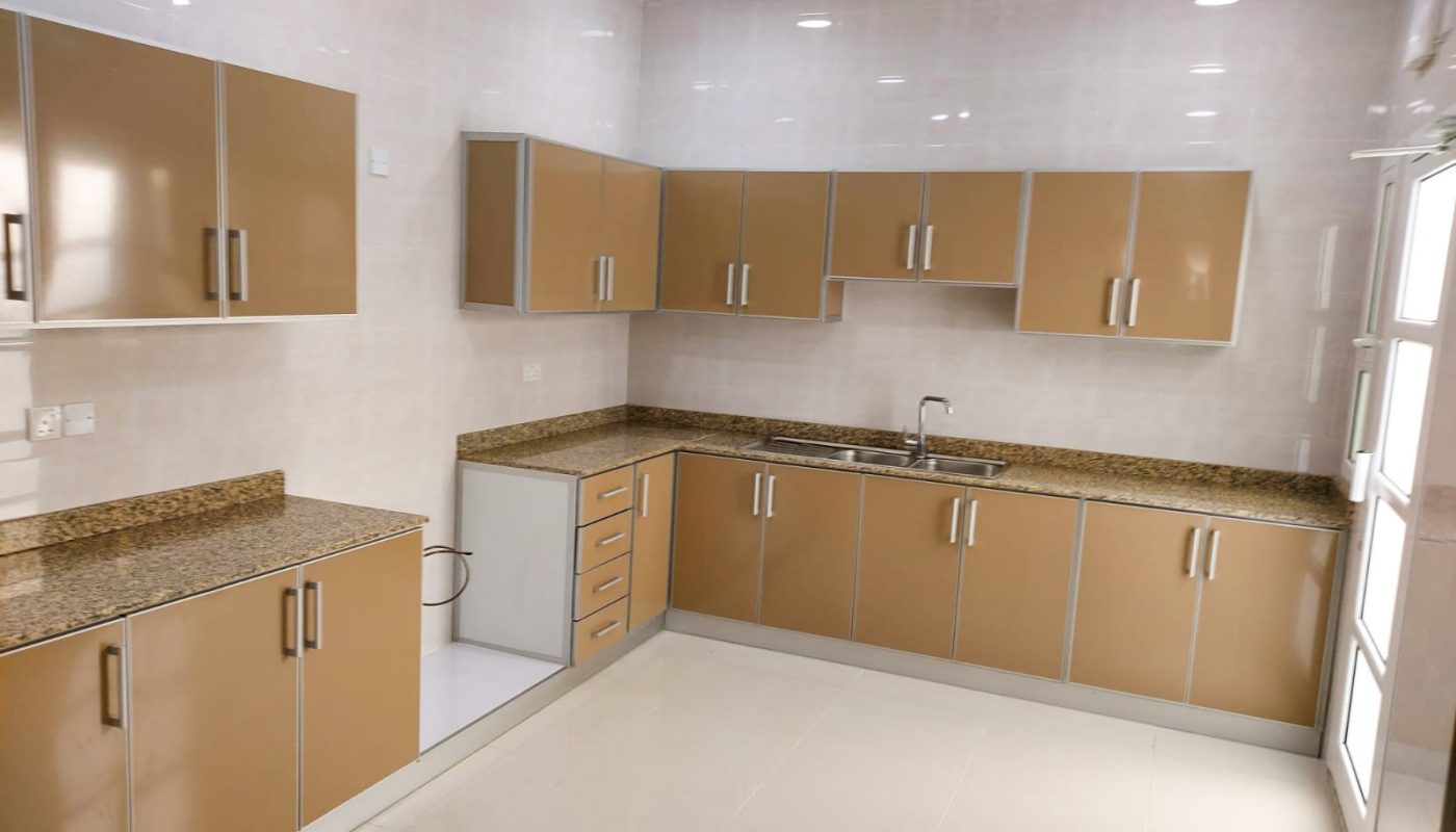 A kitchen with marble countertops.