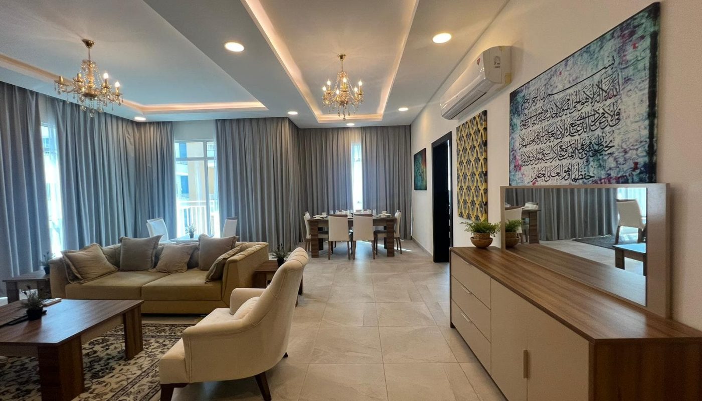 A modern living and dining room in a 170 SQM apartment for sale in Hidd.